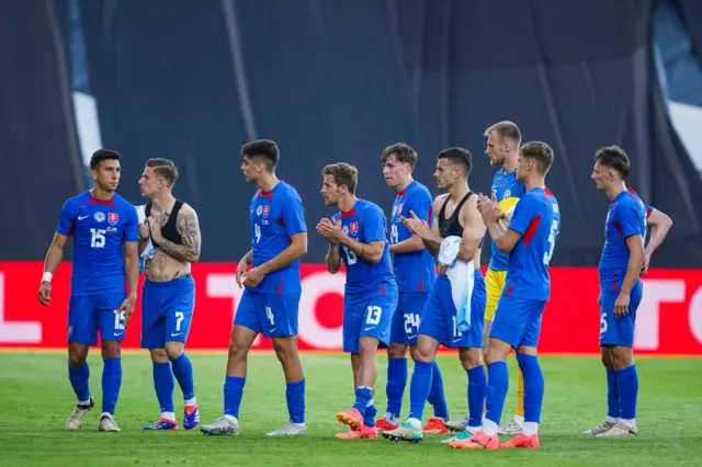 Slovakia players applaud their fans after their friendly win over San Marino