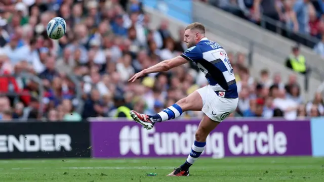 Finn Russell kicks a penalty