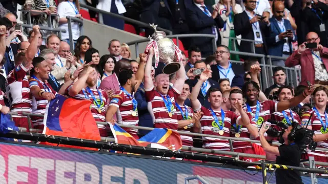 Liam Farrell lifts the Challenge Cup