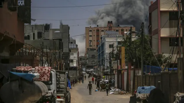 Smoke rises following an air strike during the Israeli military operation in Al Nusairat refugee camp in the Gaza