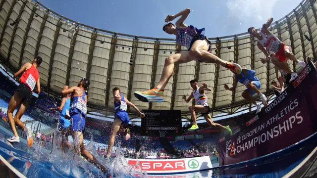 Taking flight - Runners in the men's 3000m steeplechase