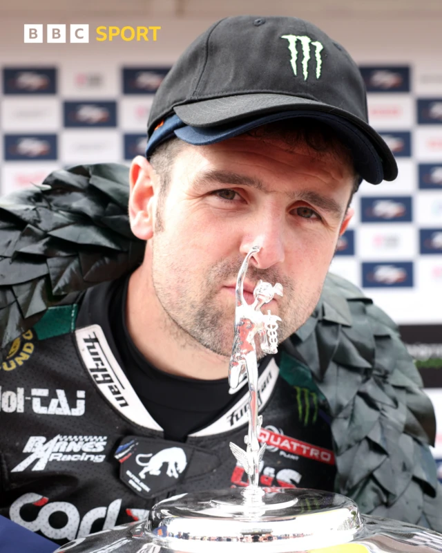 Michael Dunlop celebrates winning the Second Supertwin TT on the Isle of Man.