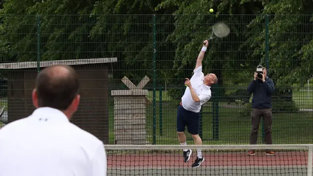 Ed Davey plays tennis