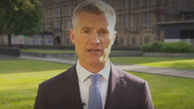 An image showing transport secretary Mark Harper outside the Houses of Parliament