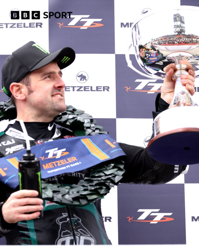 Michael Dunlop celebrates winning his record breaking 27th TT in the Supertwins race