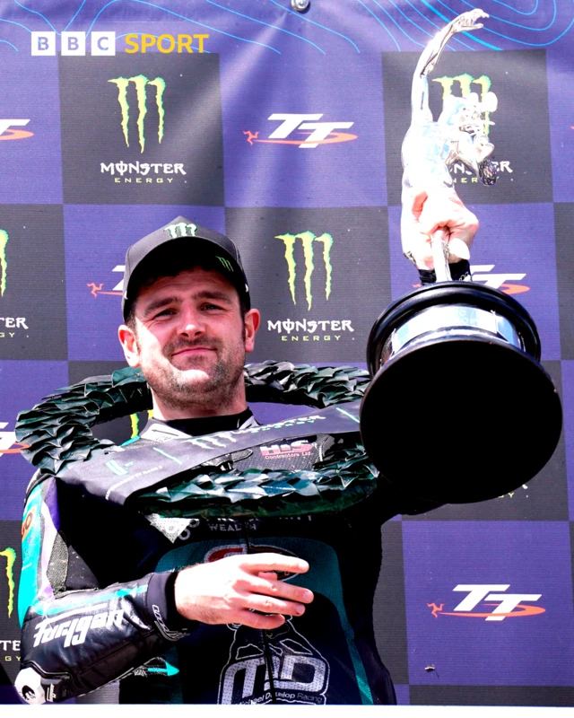 Michael Dunlop celebrates winning his 28th TT in the Supersport Race