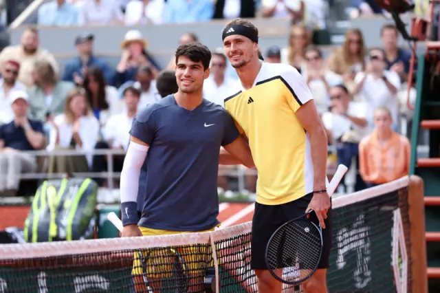 Carlos Alcaraz and Alexander Zverev posing at the net