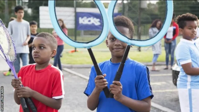 Children with tennis rackets