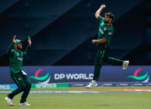 Pakistan's Haris Rauf celebrates taking a wicket against India