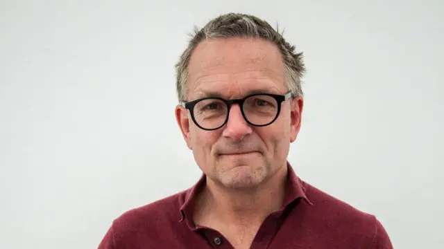 An image showing Michael Mosley wearing a red t-shirt and glasses