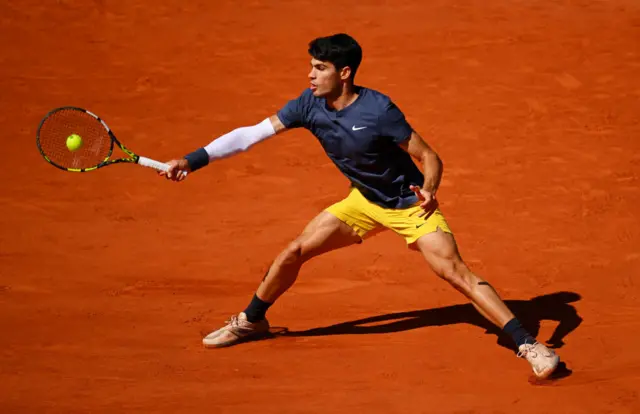 Carlos Alcaraz hitting a forehand