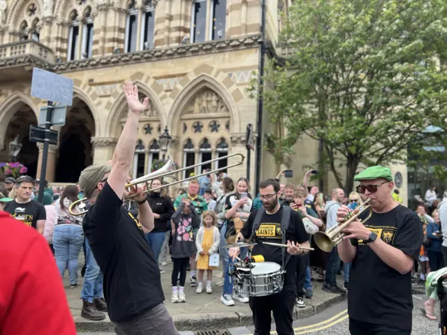 A trumpet player enjoying the Saints celebrations