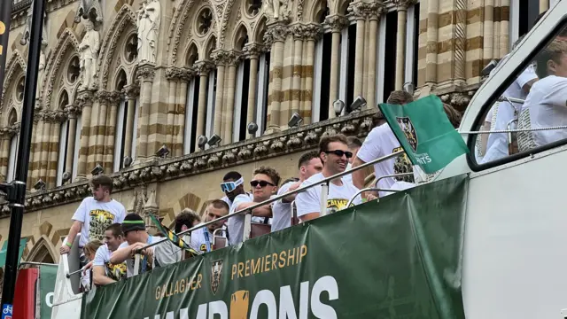 Saints players on the buses heading out of the town centre