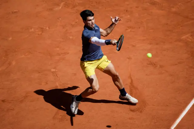 Carlos Alcaraz hitting a forehand