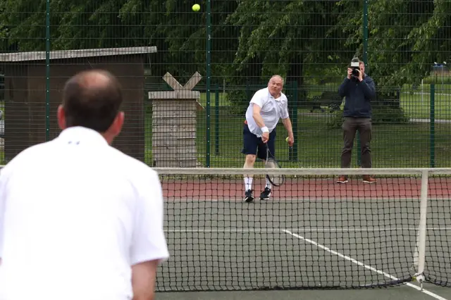 Ed Davey playing tennis