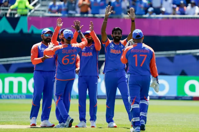 India celebrate the wicket of Babar Azam