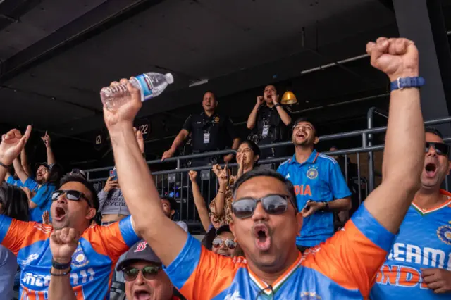 India fans celebrate a boundary against Pakistan