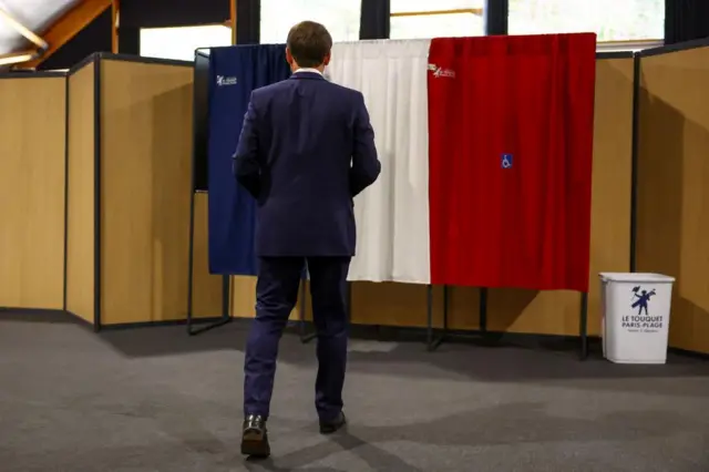 French President Emmanuel Macron votes during the European elections at a polling station in Le Touquet, France, on 9 June 2024