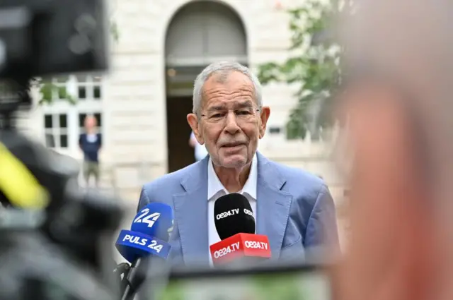 Austrian President Alexander Van der Bellen gives an interview at a polling station during the EU elections, Vienna