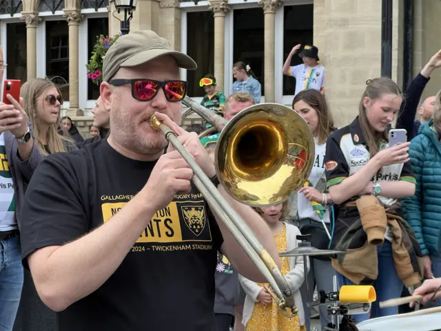 A trumpet player enjoying the Saints celebrations