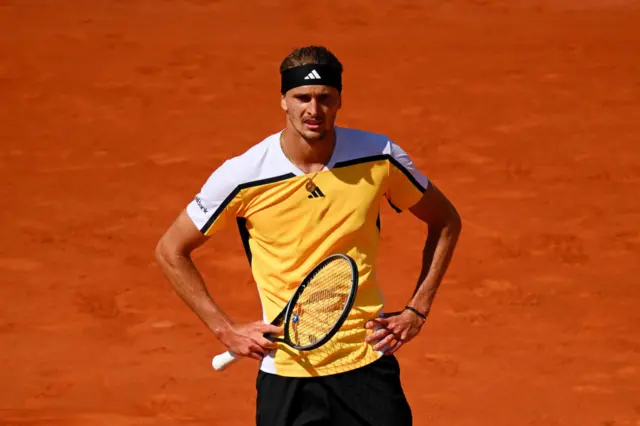 Alexander Zverev with his hands on his hips