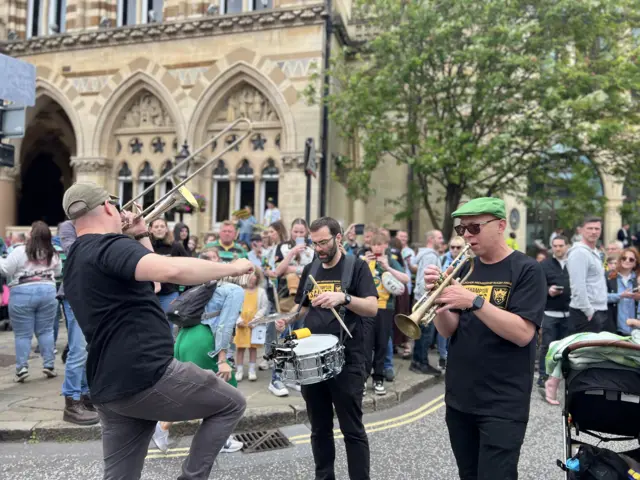 A trumpet player enjoying the Saints celebrations