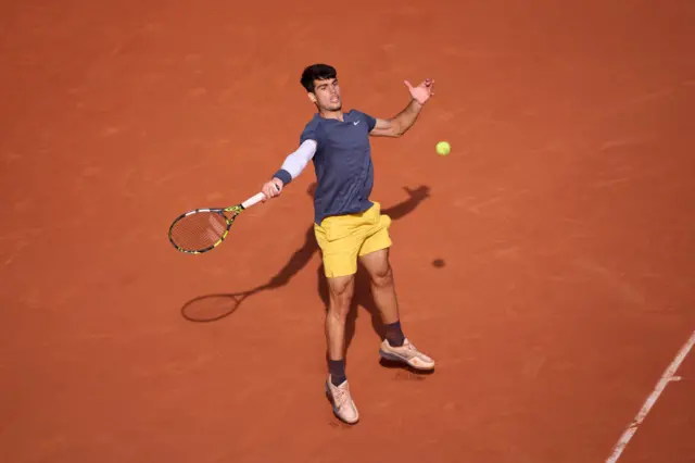 Carlos Alcaraz swinging for a forehand