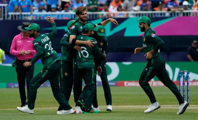 Pakistan celebrates after India's captain Rohit Sharma was caught out during the ICC men's Twenty20 World Cup 2024 group A cricket match between India and Pakistan at Nassau County International Cricket Stadium in East Meadow, New York