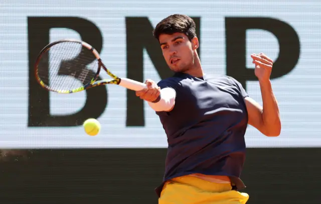 Carlos Alcaraz hitting a forehand