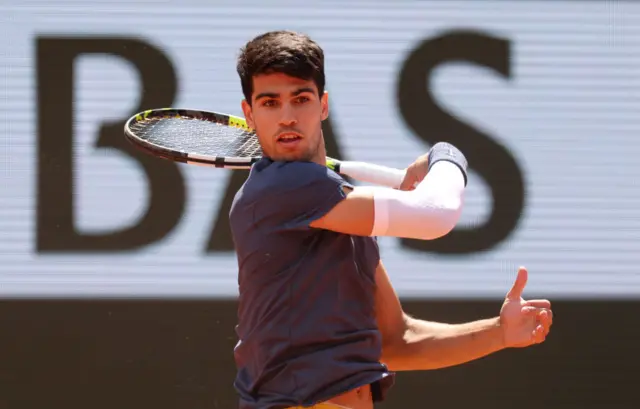 Carlos Alcaraz hitting a forehand