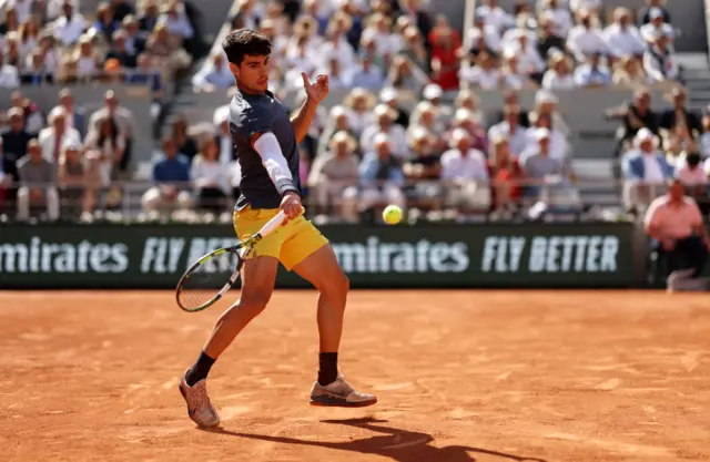 Carlos Alcaraz hitting a forehand