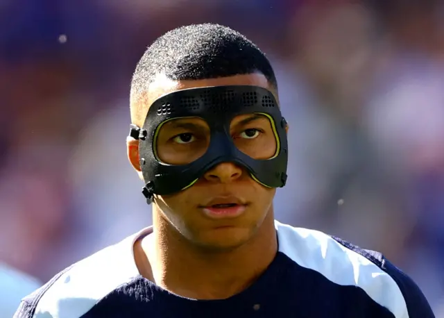 Kylian Mbappe wearing mask