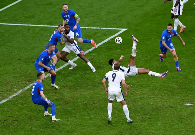 Jude Bellingham of England, scores his team's first goal with a acrobatic kick