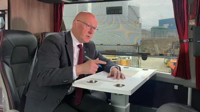 John Swinney on a bus