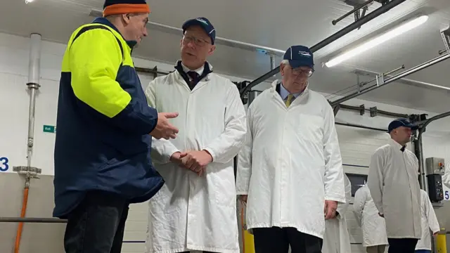 John Swinney at a fish market