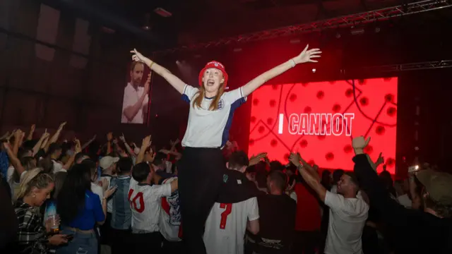 A fan celebrates in Manchester