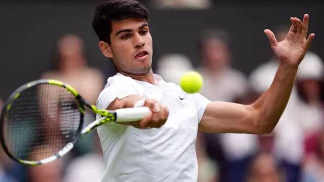 Carlos Alcaraz in action at Wimbledon