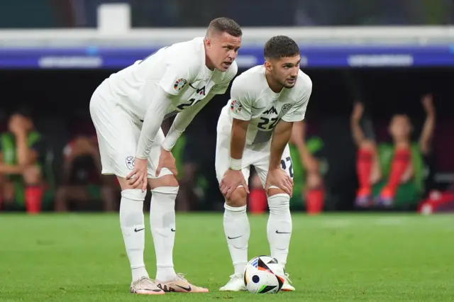 Slovenia's Adam Gnezda Cerin and Slovenia's Josip Ilicic.