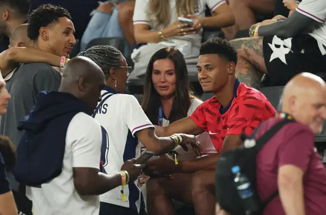 Ollie Watkins of England celebrates victory with family members