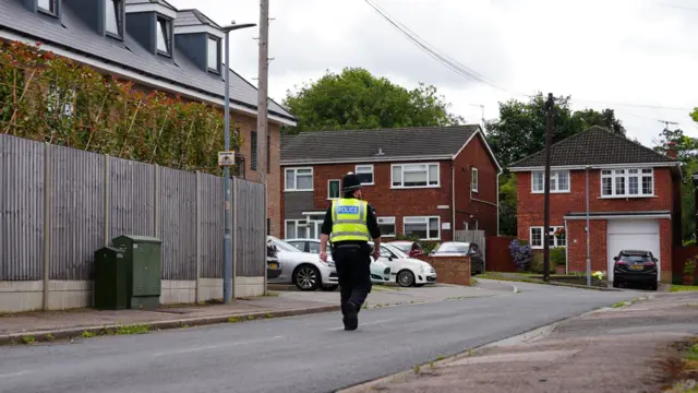 Police walking down Ashlyn Close