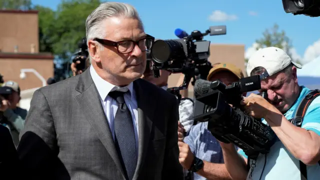 Baldwin walks outside the courthouse before the jury selection on 9 July