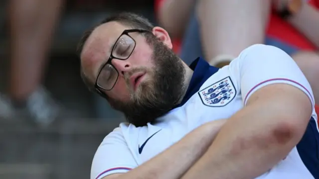 Fans of England and Slovenia wearing face paints support their teams ahead of UEFA EURO 2024 Group C match between England and Slovenia at Cologne Stadium in Cologne, Germany on June 25, 2024.