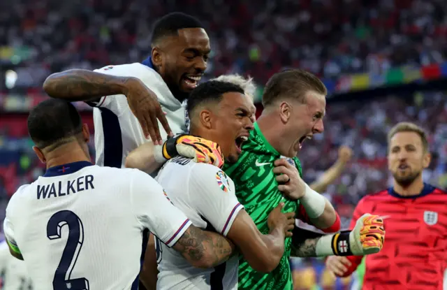 England players celebrate after beating Switzerland