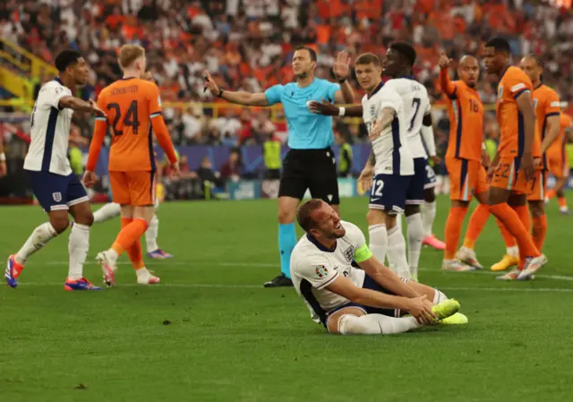 Harry Kane down holding his foot