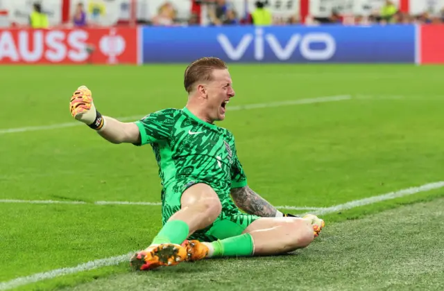 Jordan Pickford sliding in celebration