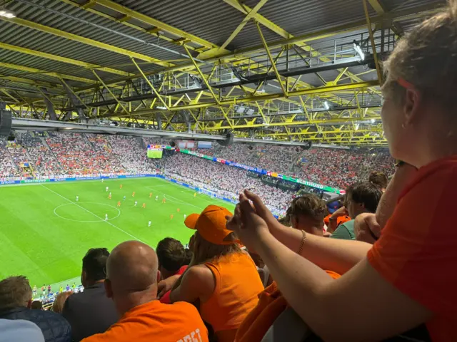 Dutch fans watch their team defending against England