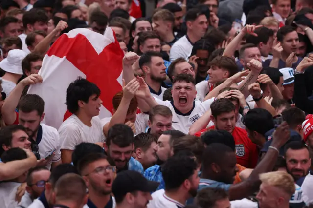 England fans celebrate after Harry Kane of England levels the score at 1-1 from the penalty spot during the UEFA EURO 2024 semi-finals