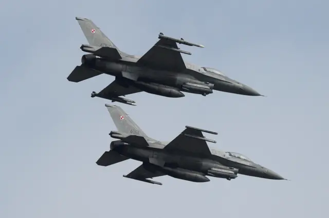 Polish Air Force F-16 fighter jets fly in formation during the Clear Sky 2018 multinational