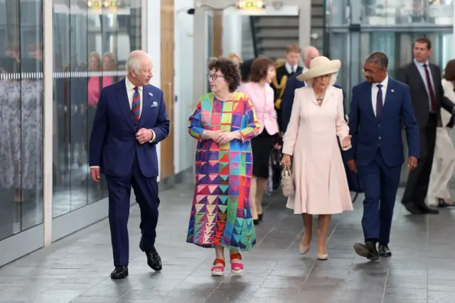 King Charles and Queen Camilla chatting to members of the Senedd