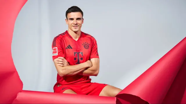 Joao Palhinha posing in the Bayern Munich kit after signing for the German club